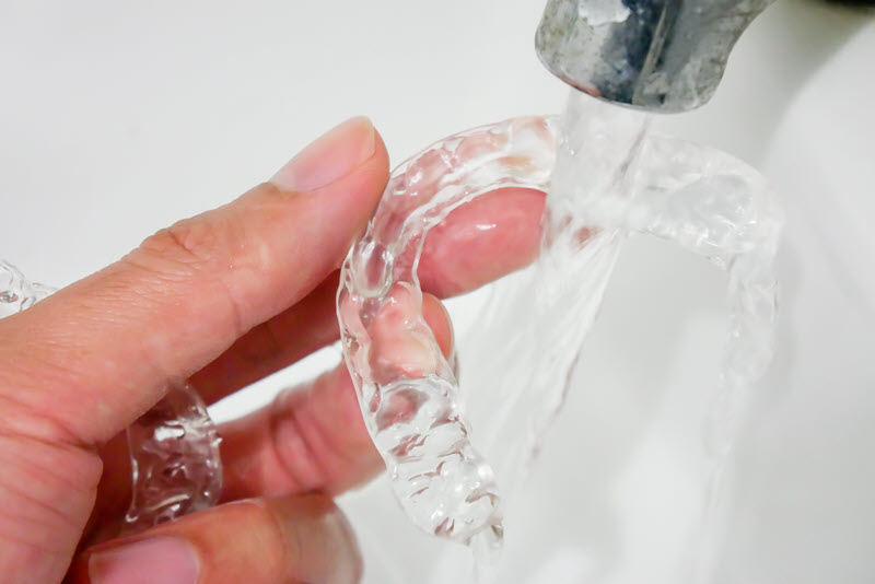 rinse your invisalign aligners in water